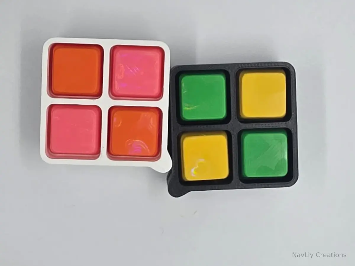 Two colorful four-key keyboard fidgets handmade by NavLiy Creations